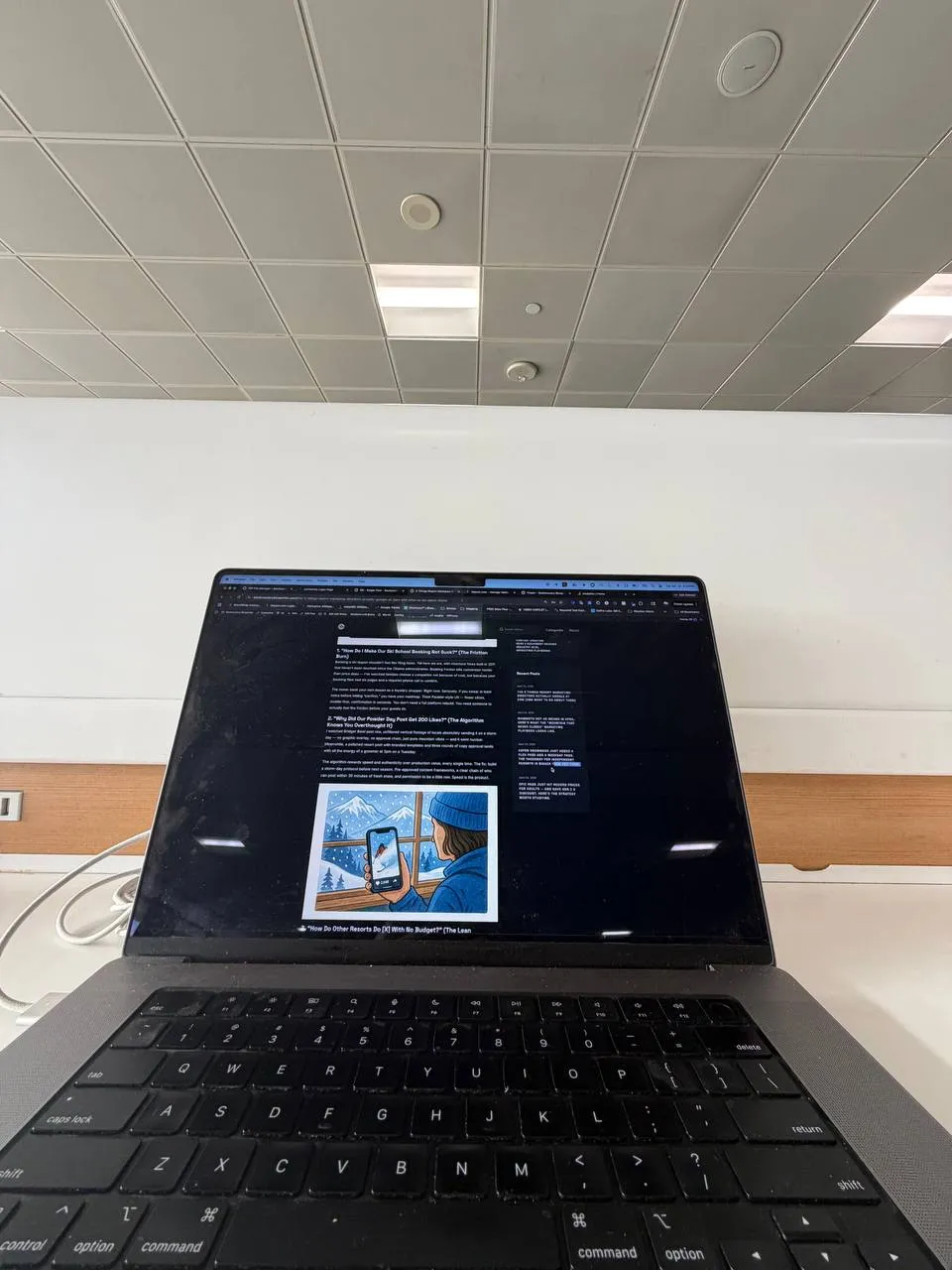 MacBook open in airport showing Backcountry Blueprints website